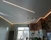 30.05.2022 - Парящий натяжной потолок со световыми линиями и скрытым карнизом - установка в кухне-гостиной - Фото №1
